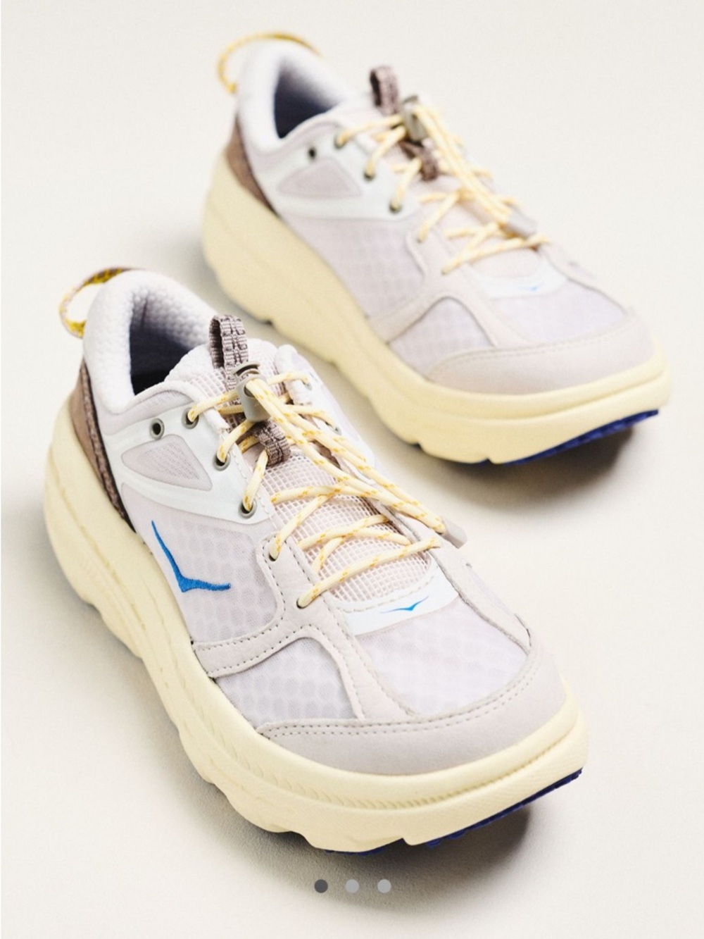 Hoka Ivory Cream Athletic Sneakers with Blue Accent